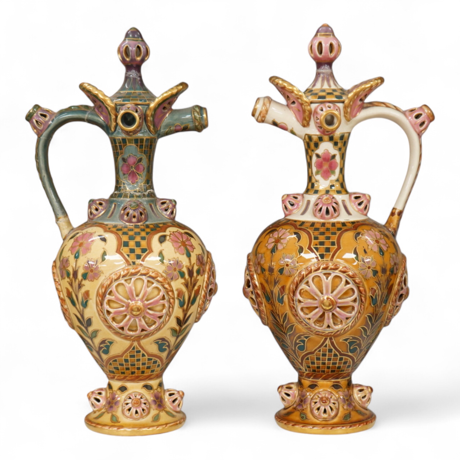 Two Zsolnay Persian inspired jugs / ewers and covers, stamped to the bases 29cm high
